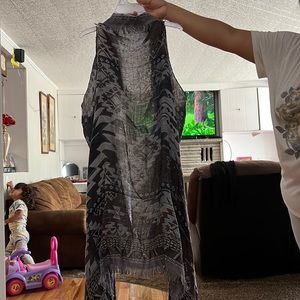 A sleeveless cardigan great to wear in the fall very comfortable and fitting